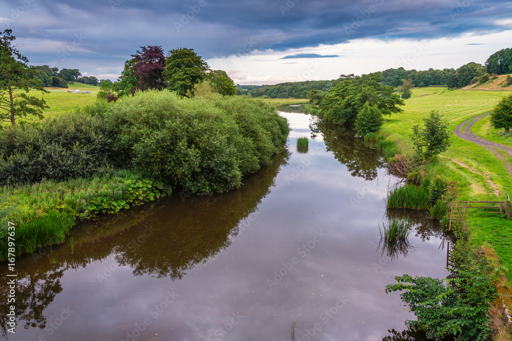 River Aln from Lion Bridge / The River Aln runs through Northumberland from Alnham to Alnmouth. Seen here as it passes the Market Town of Alnwick