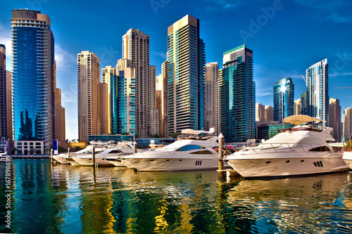 Dubai marina with luxury yachts in UAE photo