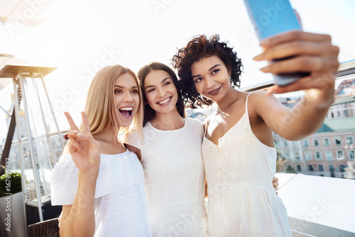 Happy joyful women posing for a photo