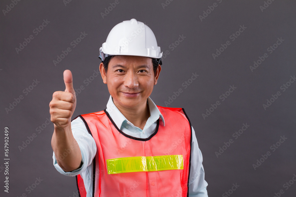 thumb up from confident, professional asian male engineer, civil construction, builder, architect, worker thumb up from confident, professional asian male engineer, civil construction, builder, architect, worker