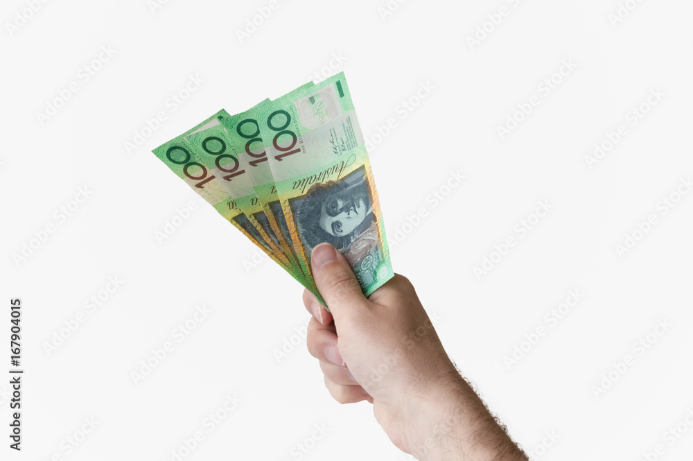 Man holding four hundred Australian Dollar notes in his hand Man holding four hundred Australian Dollar notes in his hand