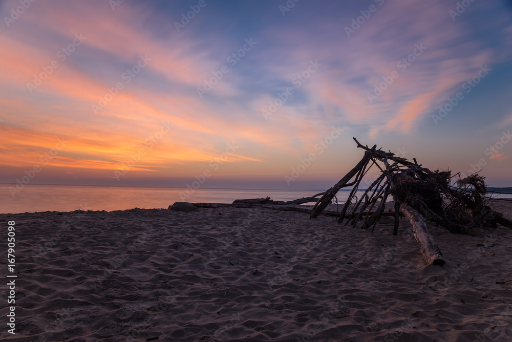 Branch wooden house on tropical beach in sunset time, deserted beach