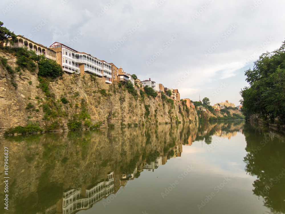Houses on the edge of a cliff above the river Kura. Tbilisi, the historic city center.