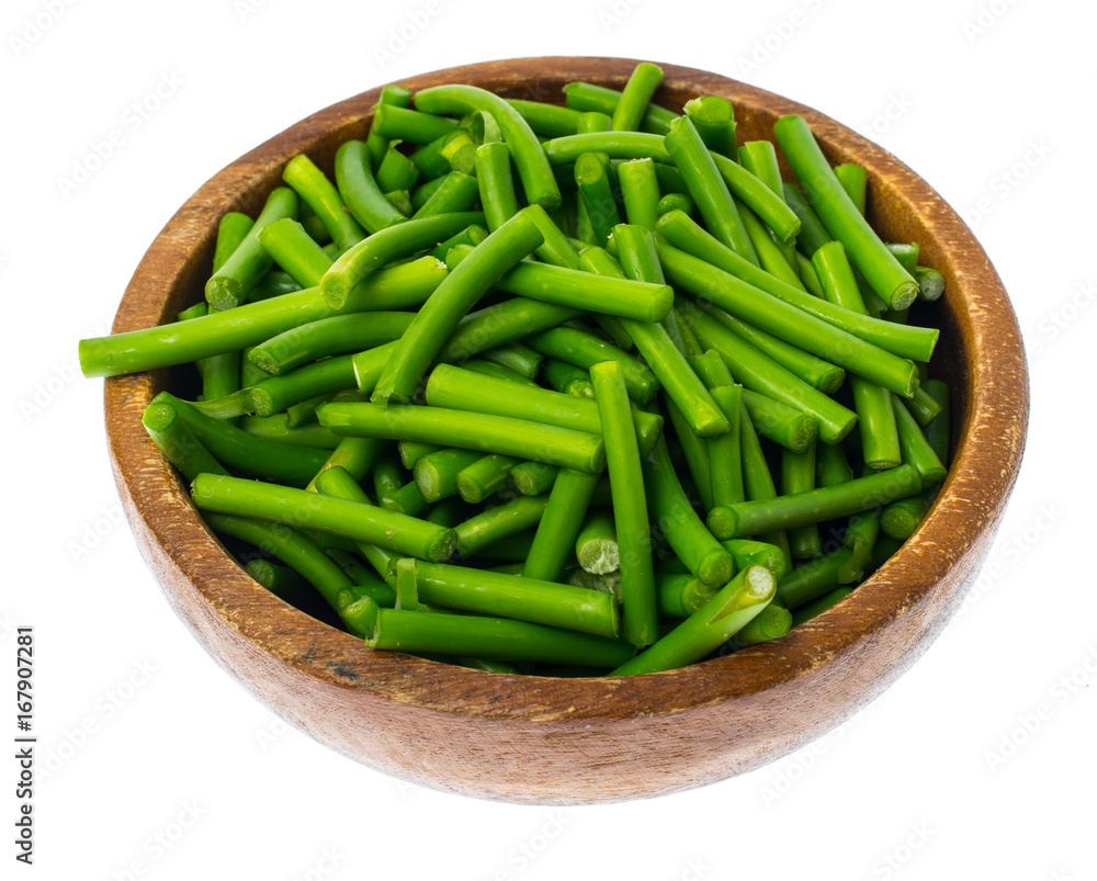 Wooden bowl with green pods, isolated on white background Wooden bowl with green pods, isolated on white background
