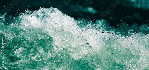 Canvas Print Splash of stormy water in the ocean on a black background