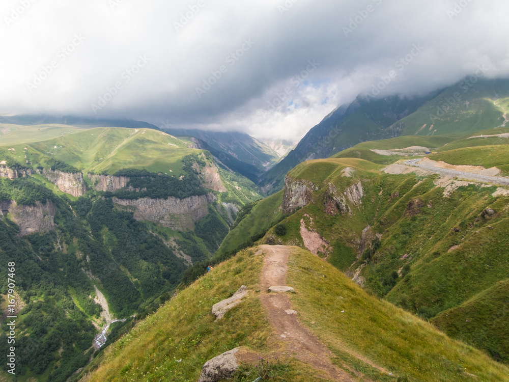 Fototapeta premium Beautiful green mountains in the clouds