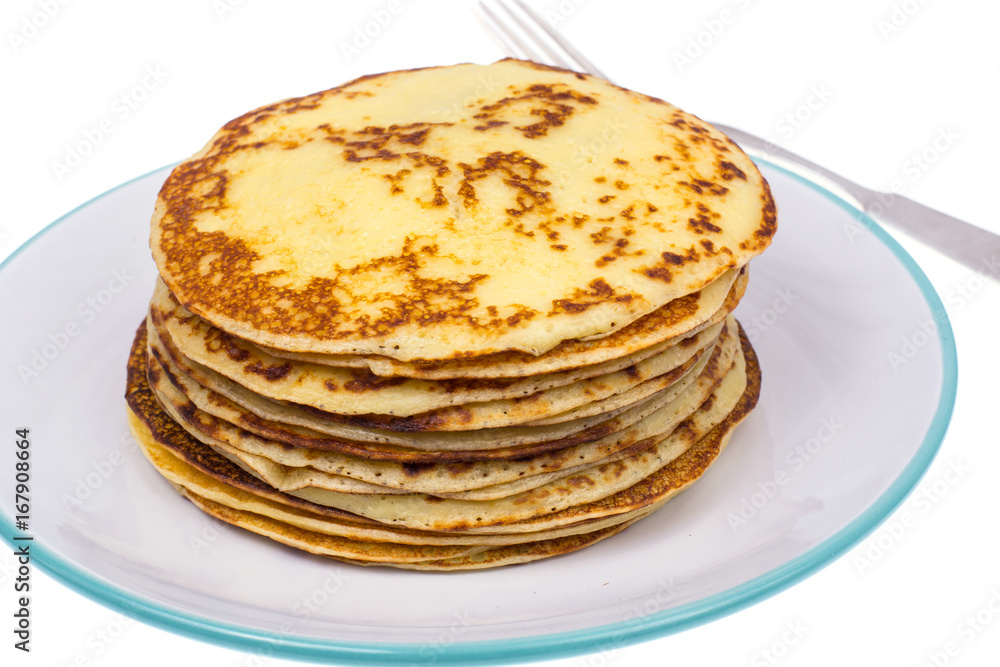 Crispy thin pancakes on plate, light background Crispy thin pancakes on plate, light background