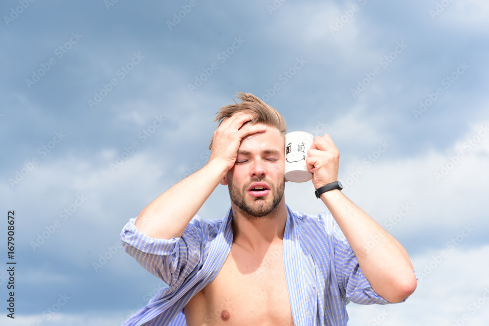 Male model posing against the sky. Male model posing against the sky.