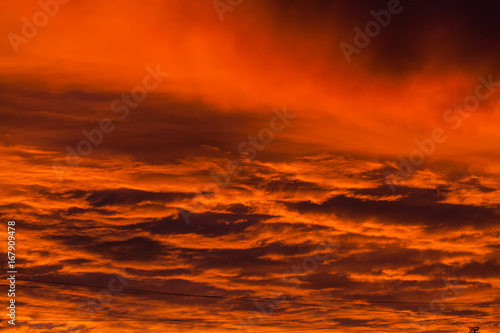 Red voluminous clouds at sunrise