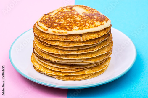Pancakes on bright pastel color