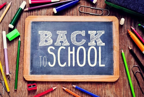 the text back to school written in a chalkboard