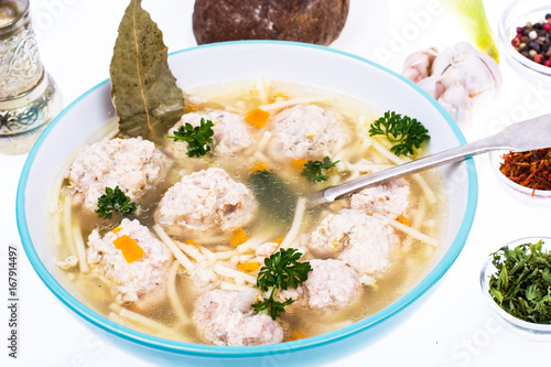 Broth with vermicelli and meatballs in a plate