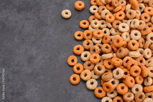 Tablou pe pânză Multigrain hoops breakfast cereal on grey slate background