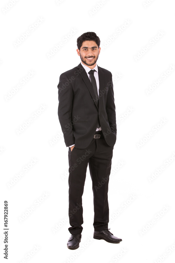 Full length shot of a happy handsome young businessman with hand in pocket smiling and looking to you, guy wearing black suit and black tie, isolated on white background Full length shot of a happy handsome young businessman with hand in pocket smiling and looking to you, guy wearing black suit and black tie, isolated on white background