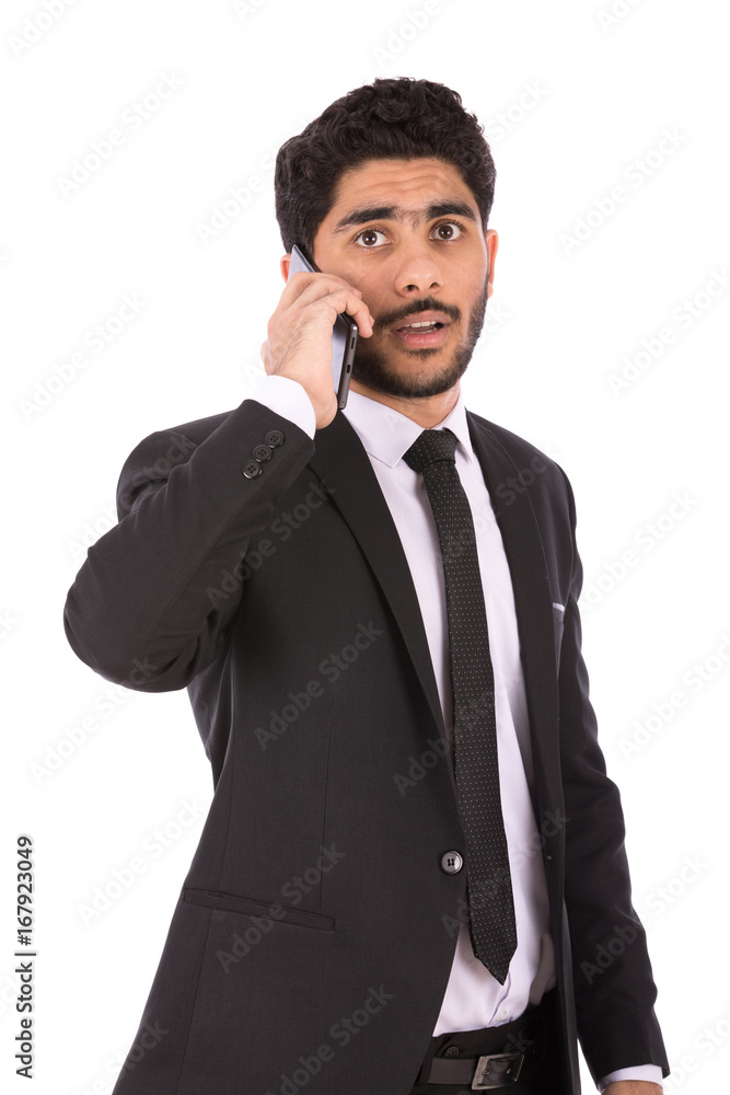 Happy handsome young businessman smiling and making a call, guy wearing black suit and black tie, isolated on white background Happy handsome young businessman smiling and making a call, guy wearing black suit and black tie, isolated on white background