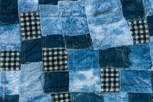 Fabric patchwork background and texture, Thread of old fabric blue tone for background photo