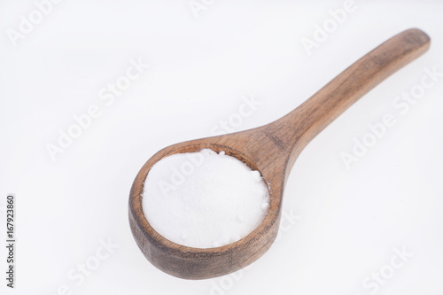 baking soda (sodium bicarbonate) in a wooden spoon