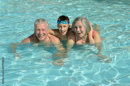 grandparents with grandson in swimming pool © aletia2011