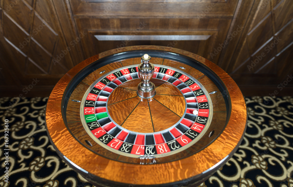 American Roulette wheel with a ball in the number '1' American Roulette wheel with a ball in the number '1'