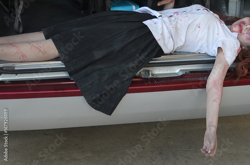 Car Accident .Dead woman lying on a street