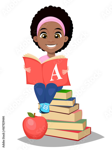 Back to school. Cute Afro-American girl holding primer and sitting on a stack of books. Pretty little schoolgirl.