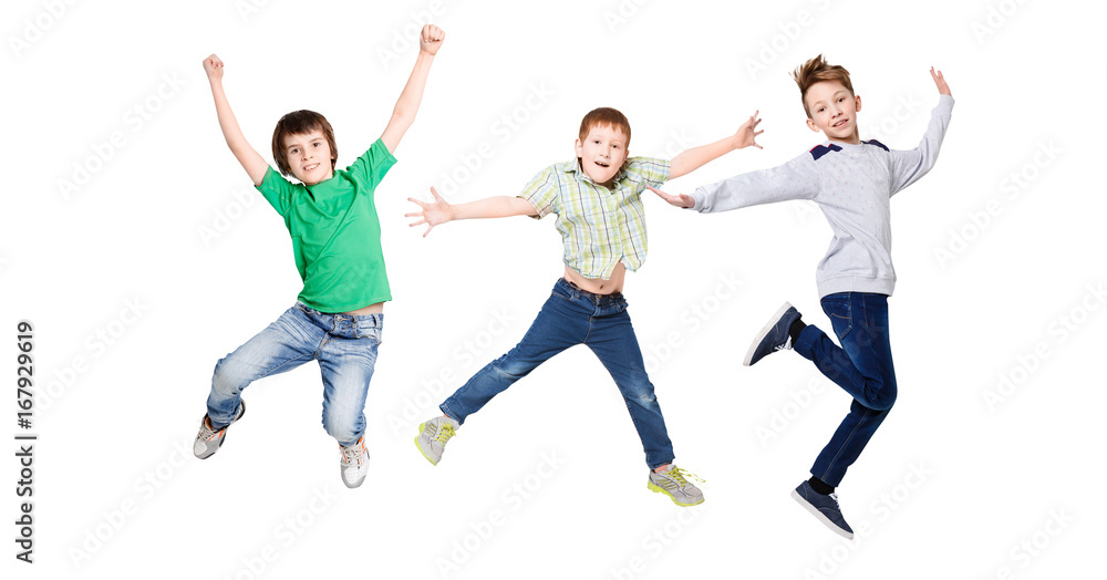 Happy kids jumping at studio, copy space Happy kids jumping at studio, copy space