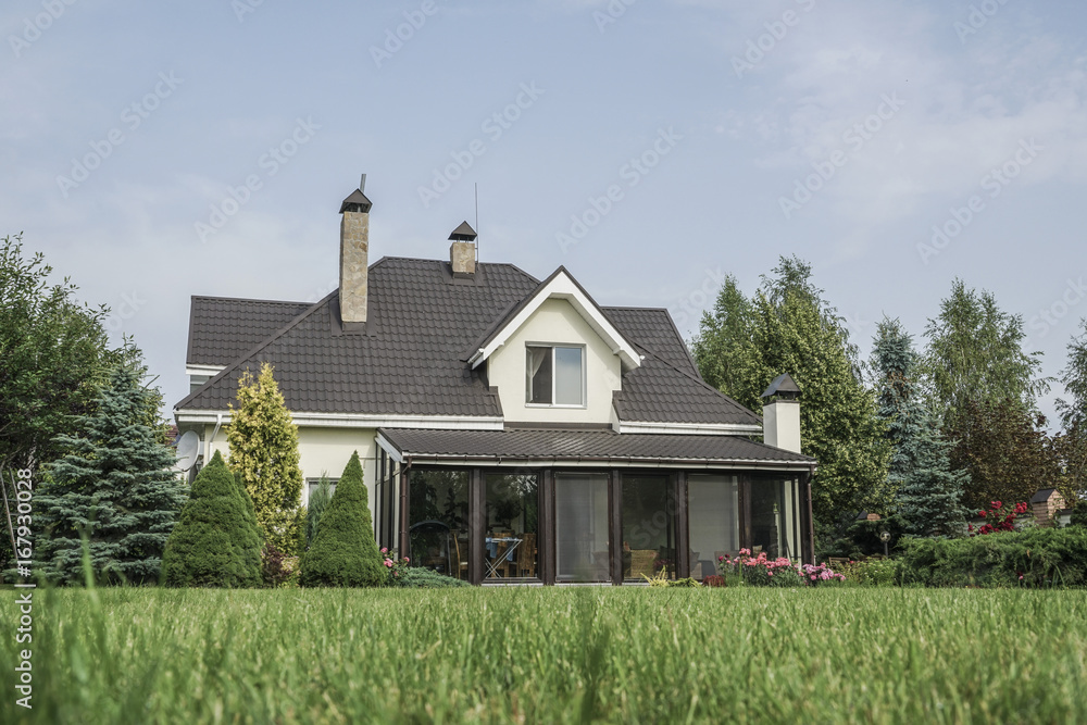 private house and its garden under beautiful sky private house and its garden under beautiful sky