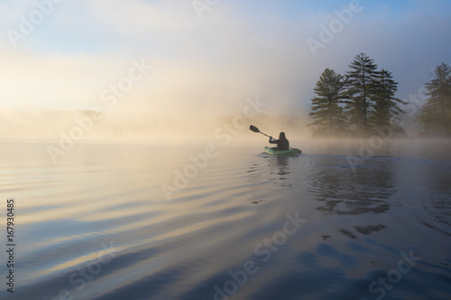 Kayaking at dawn. Grafton Pond, Enfield, New Hampshire, United States.