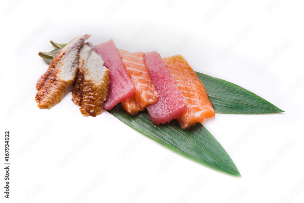 Sashimi set on bamboo leaf isolated at white Sashimi set on bamboo leaf isolated at white