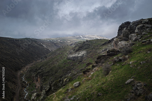 Mountain landscape. River at bottom of canyon. Mount Aragats. Travel to Armenia.