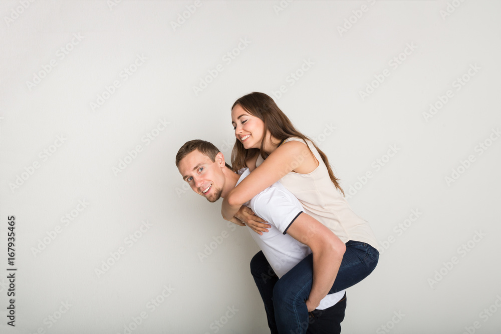 Loving couple, man piggybacking girlfriend Loving couple, man piggybacking girlfriend