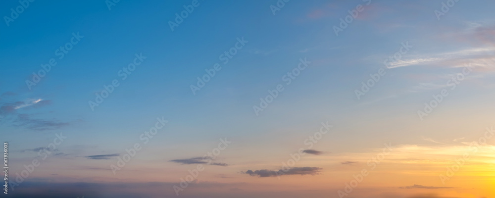 Vibrant color panoramic sun rise and sun set sky with cloud on a cloudy day. Beautiful cirrus cloud. Panorama high resolution photograph.