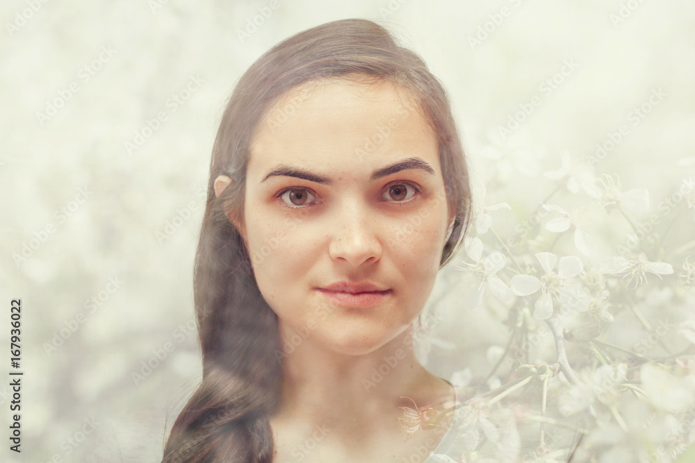 ouble exposure of a young woman and blossoming branch of a cherry ouble exposure of a young woman and blossoming branch of a cherry
