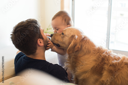 Family having fun with a feeding bottle