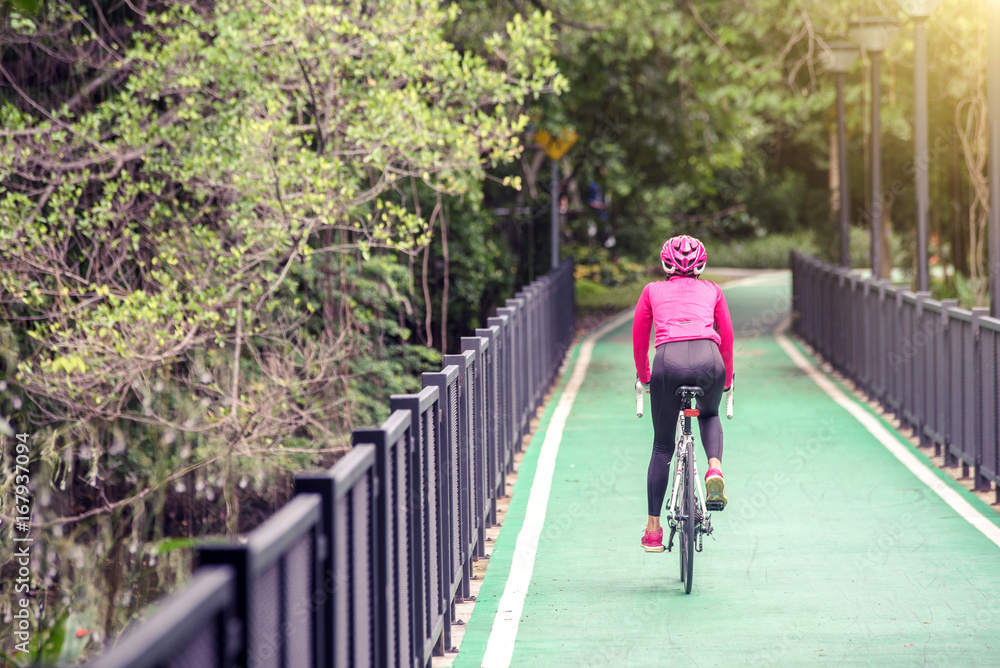 Obraz premium Women cycling outdoor exercise bike trails.