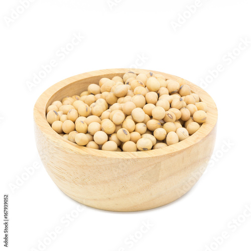 Soybeans in a wooden bowl on a white background