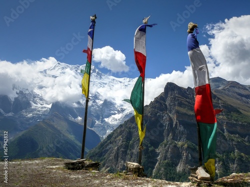 Prayer flags and Annapurna from Ghyaru village, Nepal photo