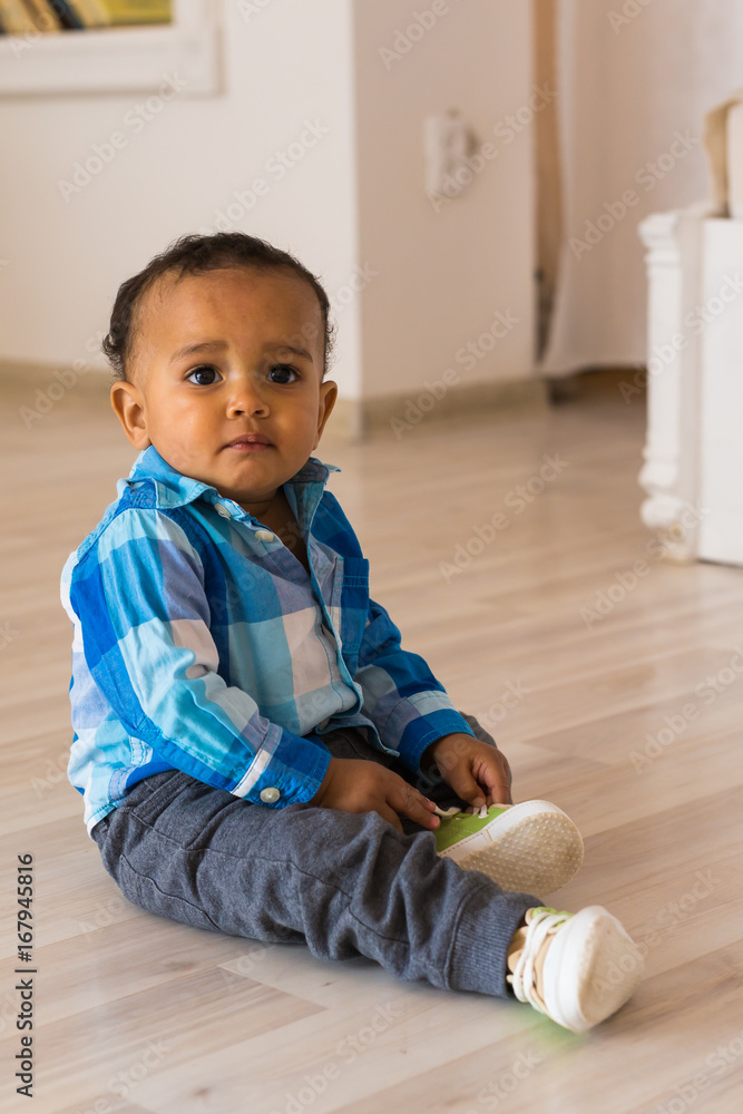 Naklejka premium African American baby boy indoors