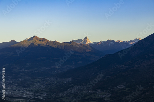 Sunrise on the tops of the mountains above Aosta Valley