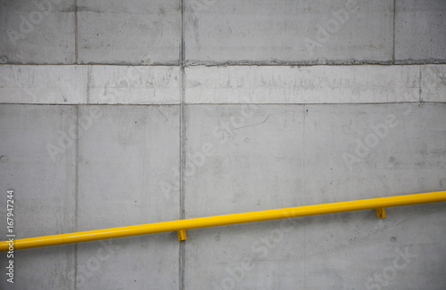 Industrial texture of grey concrete with yellow rail © Viktorie
