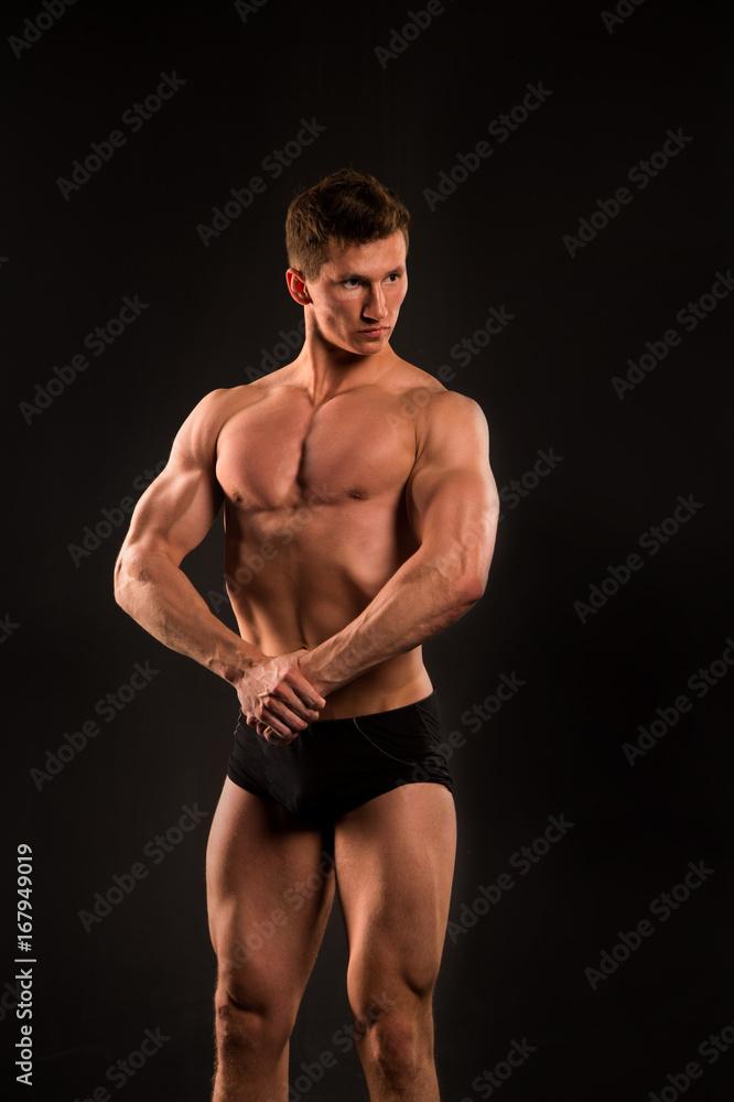 man with muscular body of bodybuilder in pants