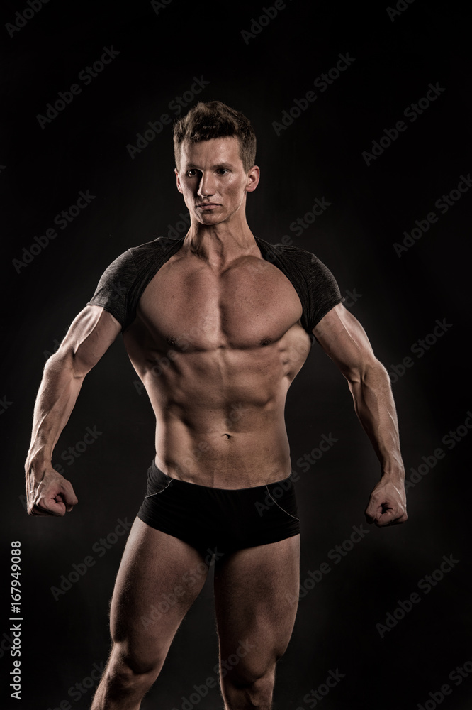 man with muscular body of bodybuilder in pants