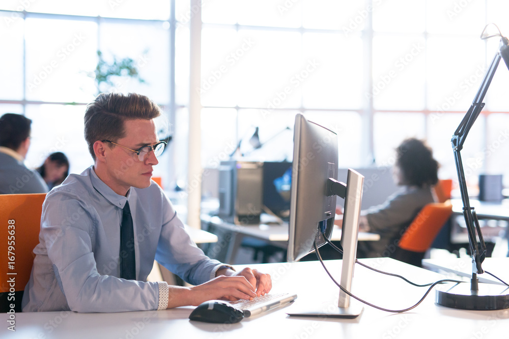 businessman working using a computer in startup office businessman working using a computer in startup office