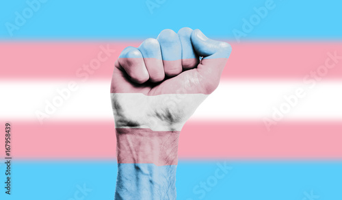 Foto Transgender flag painted on a clenched fist