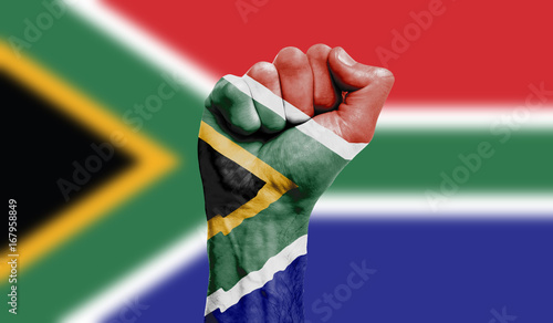 South Africa flag painted on a clenched fist. Strength, Power, Protest concept photo