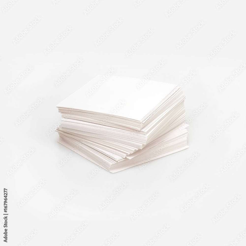 A pack of blank paper on a white background for presentation of a design project to a customer A pack of blank paper on a white background for presentation of a design project to a customer