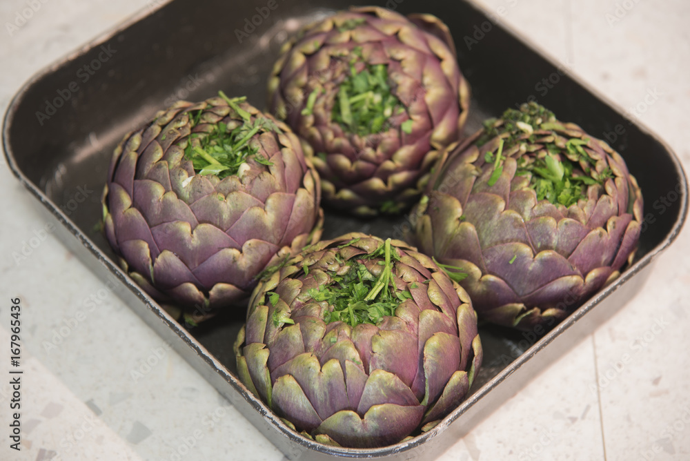 Fototapeta premium Cooking the artichokes