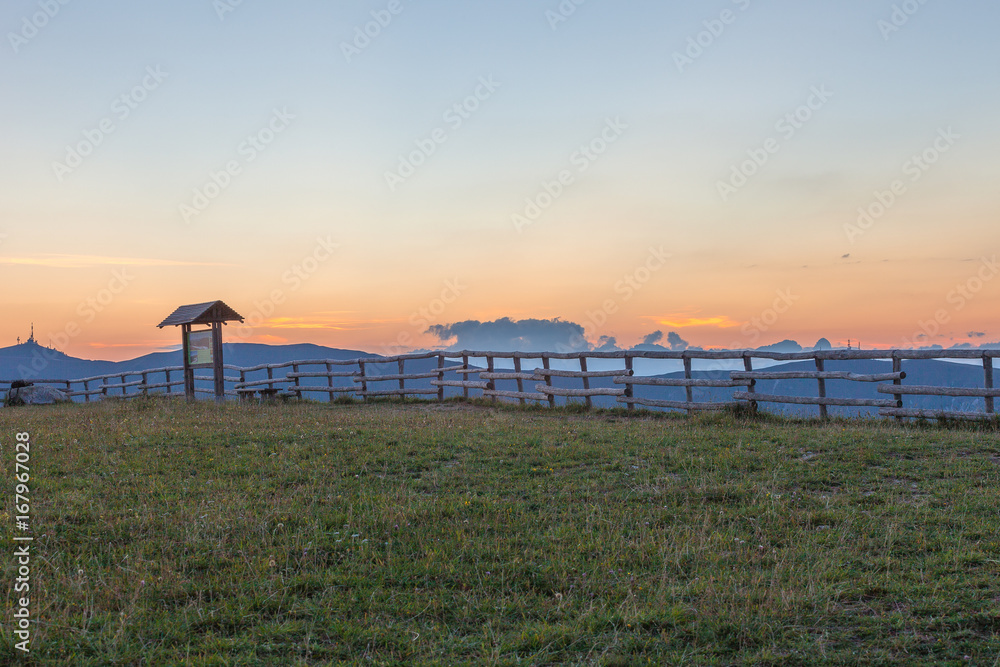 Sunset on Dolomites silhouette from Monte Pizzoc summit, Veneto, Italy