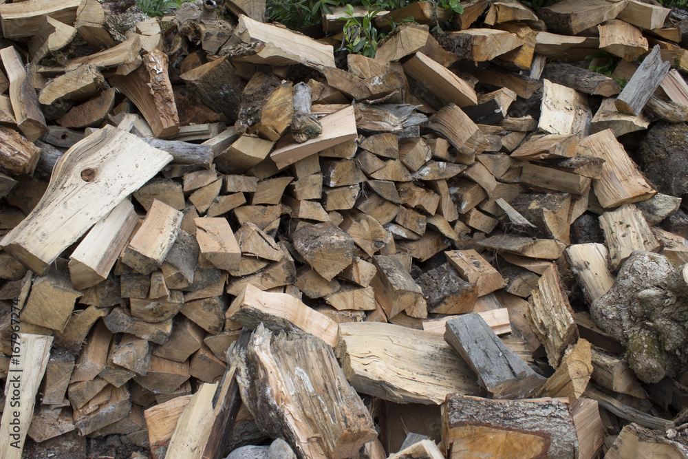 Pile of firewood. Preparation of firewood for the winter. Background Pile of firewood. Preparation of firewood for the winter. Background