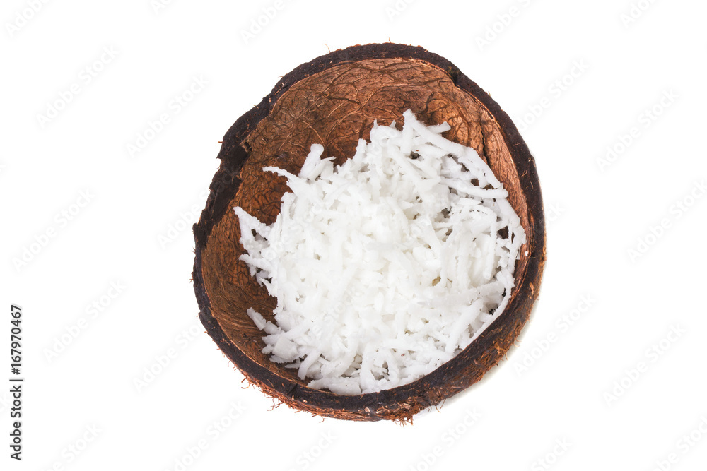 Half of the broken coconut filled with coconut shavings Half of the broken coconut filled with coconut shavings